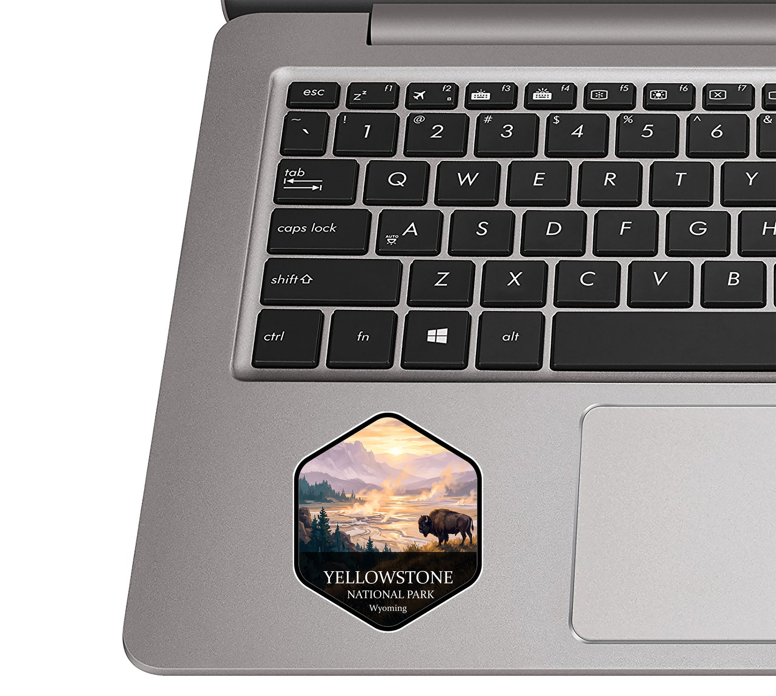 Yellowstone National Park badge sticker applied to the palm rest of a silver laptop