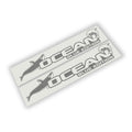 Grey Ocean Blue Edition dolphin lettering side hood vinyl decal pair shown laid flat