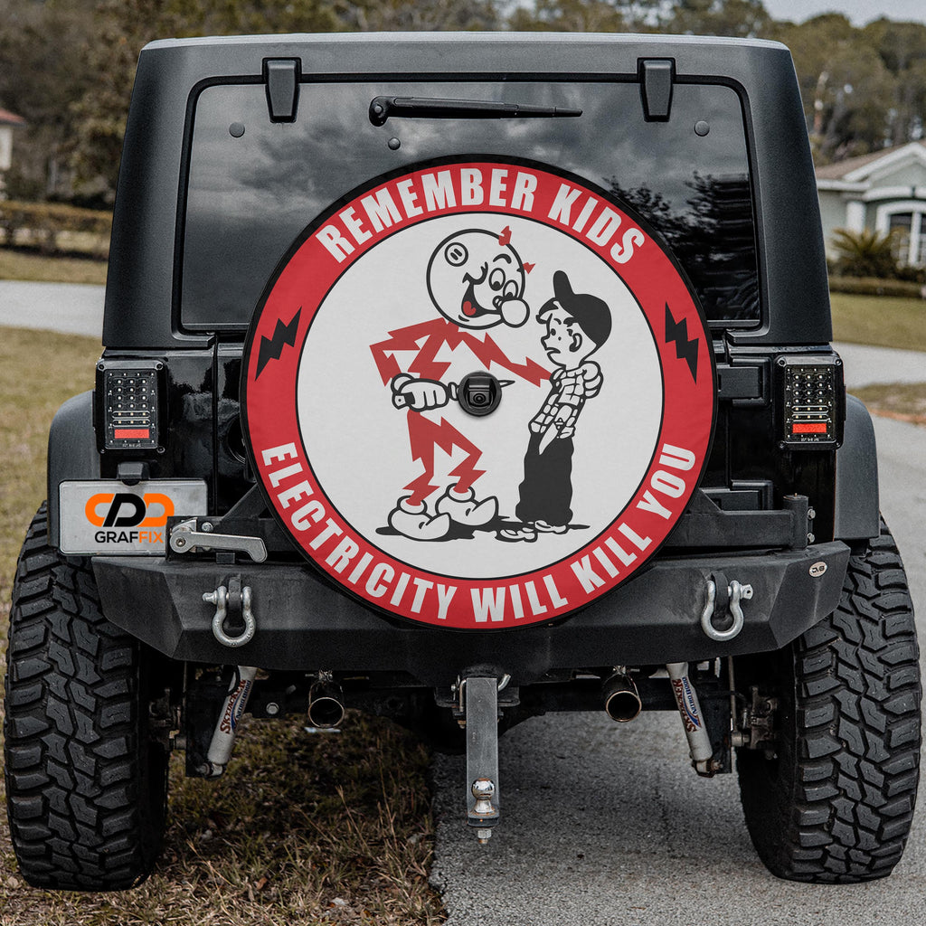 Remember Kids Electricity Will Kill You spare tire cover with a backup camera opening, mounted on a black Jeep Wrangler