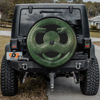 Jade serpent cult amulet spare tire cover mounted on a Jeep Wrangler