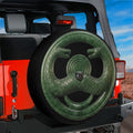 Jade serpent cult amulet spare tire cover on a Jeep Wrangler, rear view