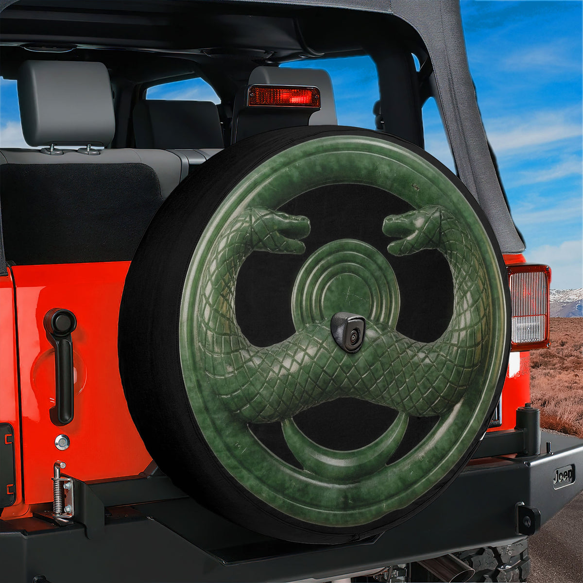 Jade serpent cult amulet spare tire cover on a Jeep Wrangler, rear view