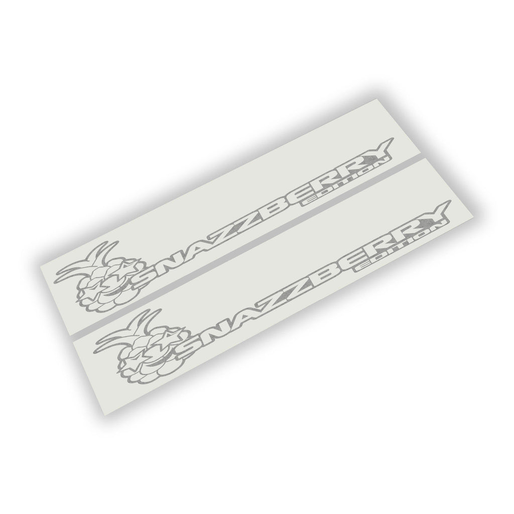 Silver Snazzberry Edition pineapple side hood decal pair shown laid on white backing