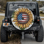 Star-Spangled Sunflower spare tire cover mounted on a Jeep Wrangler showcasing the patriotic sunflower in outdoor light