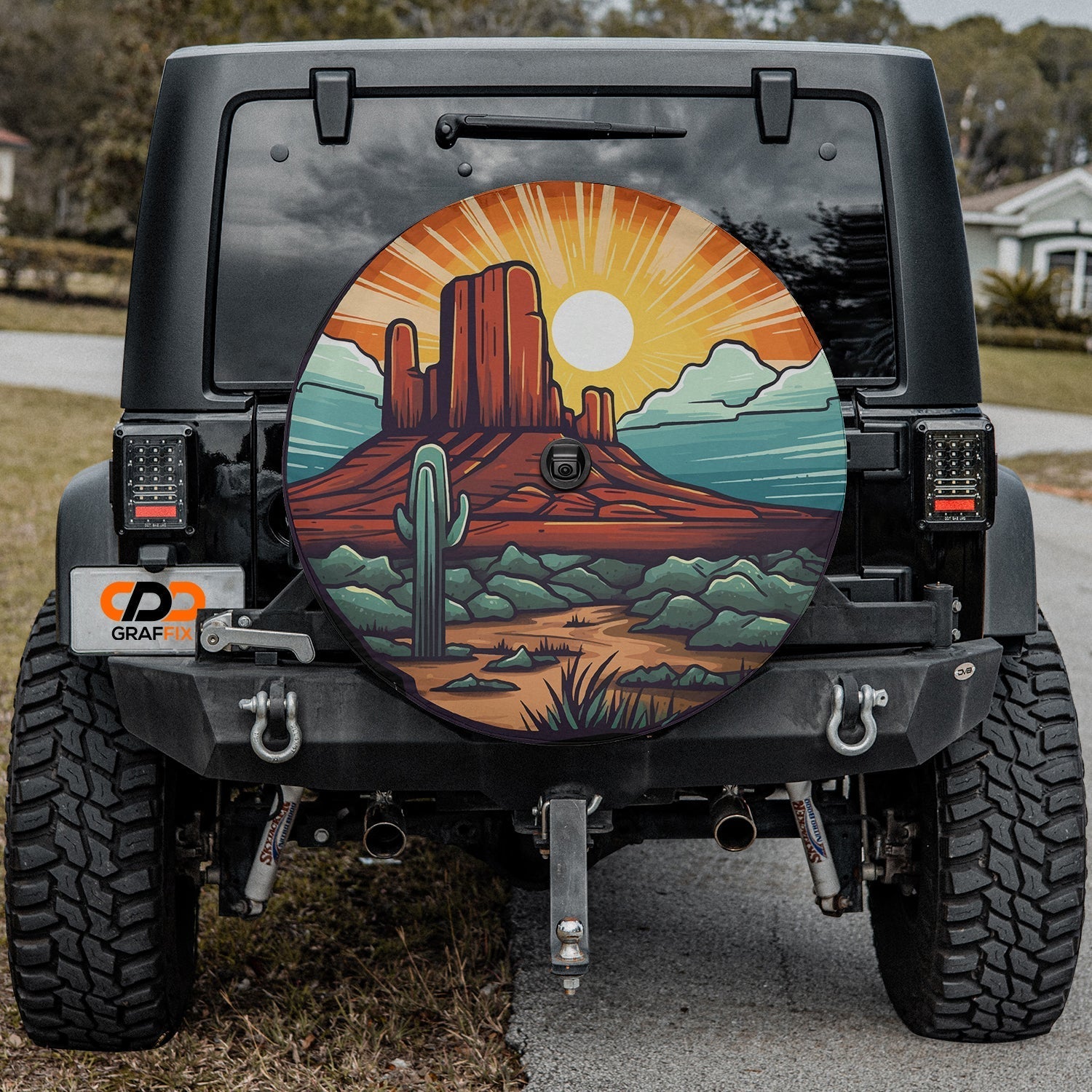 Black Jeep Wrangler with sunset over Sedona tire cover showing red mesa saguaro cactus golden sunrise