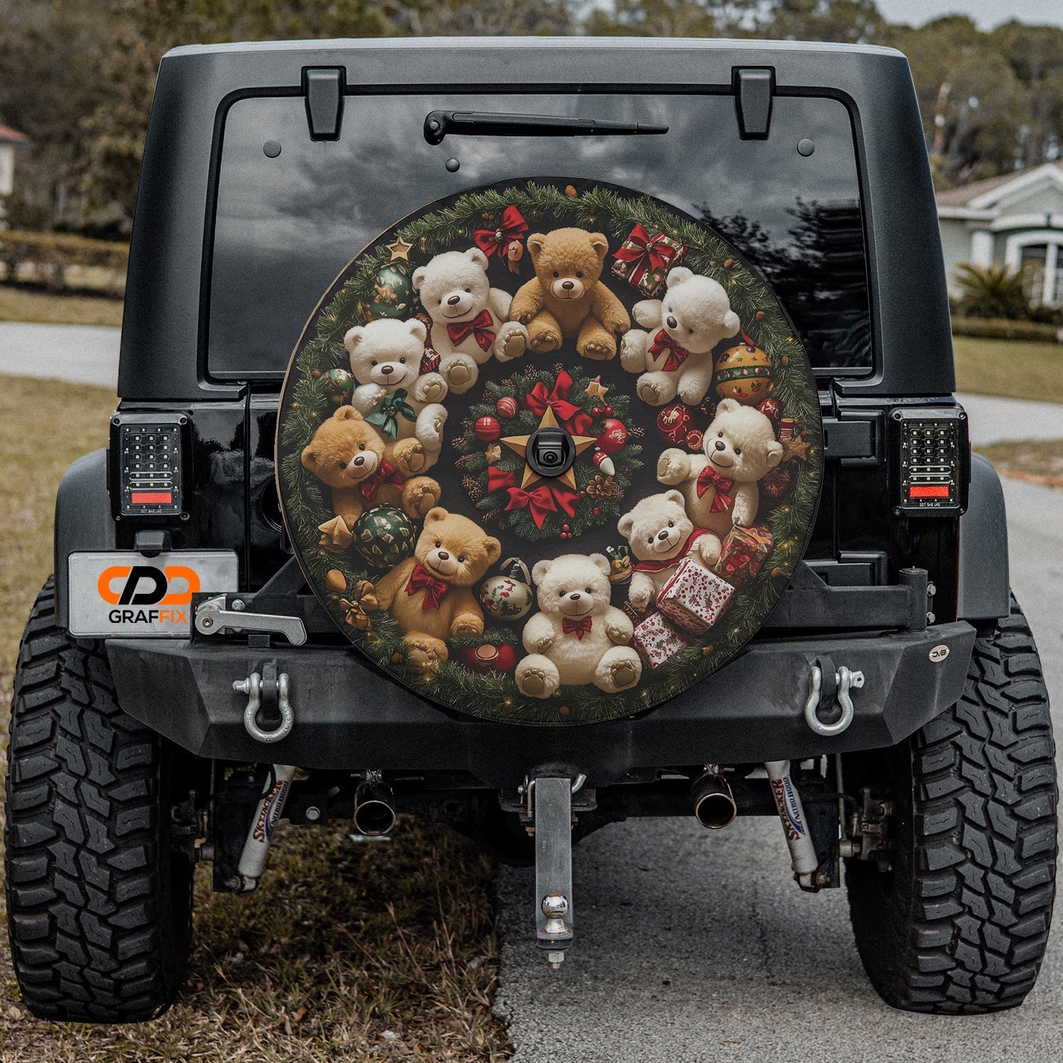 Teddy Bear Wreath spare tire cover installed on black Jeep Wrangler with center backup camera cutout