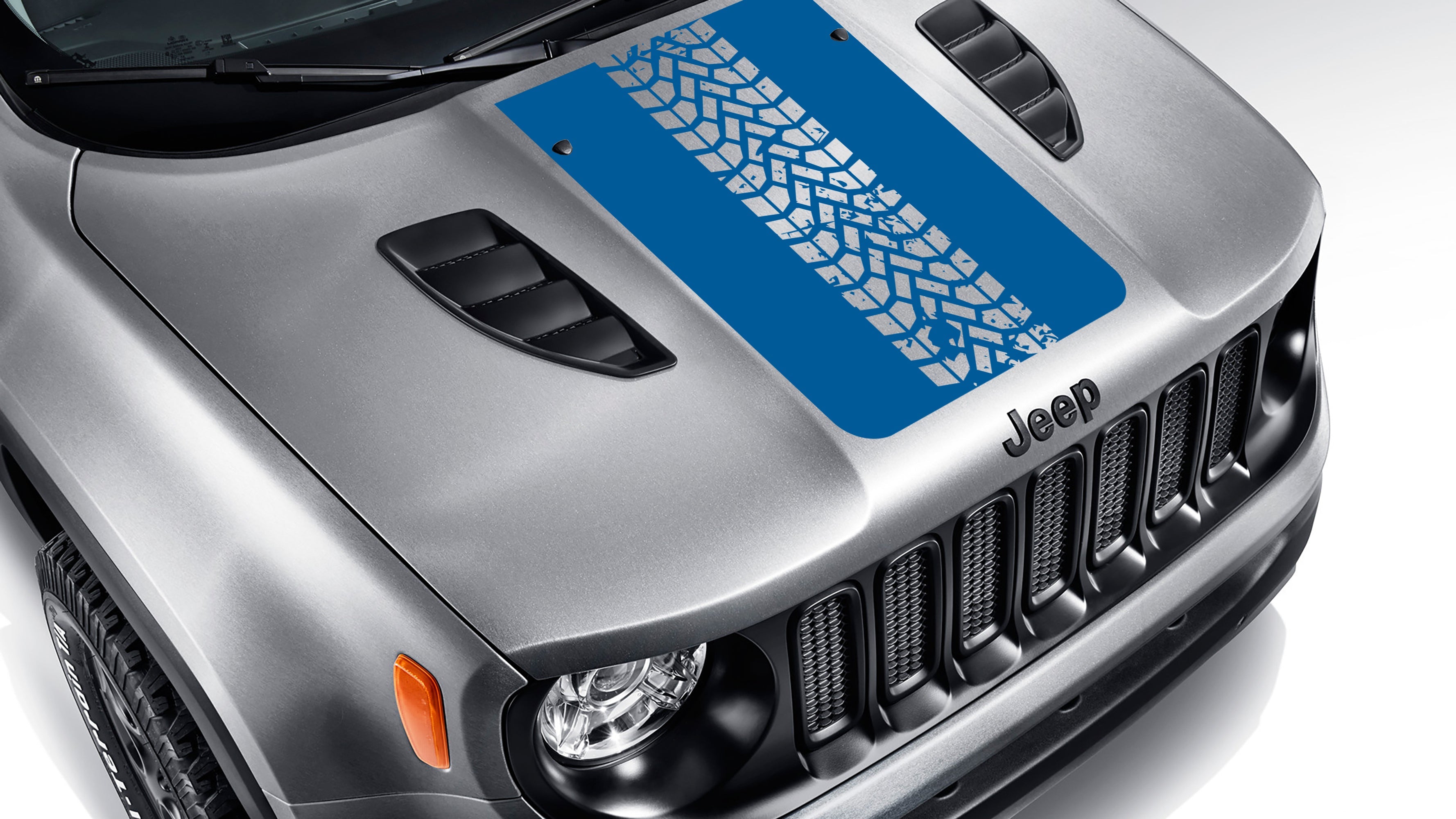 Azure blue tire track blackout hood vinyl decal on silver Jeep Renegade hood with bold tread pattern