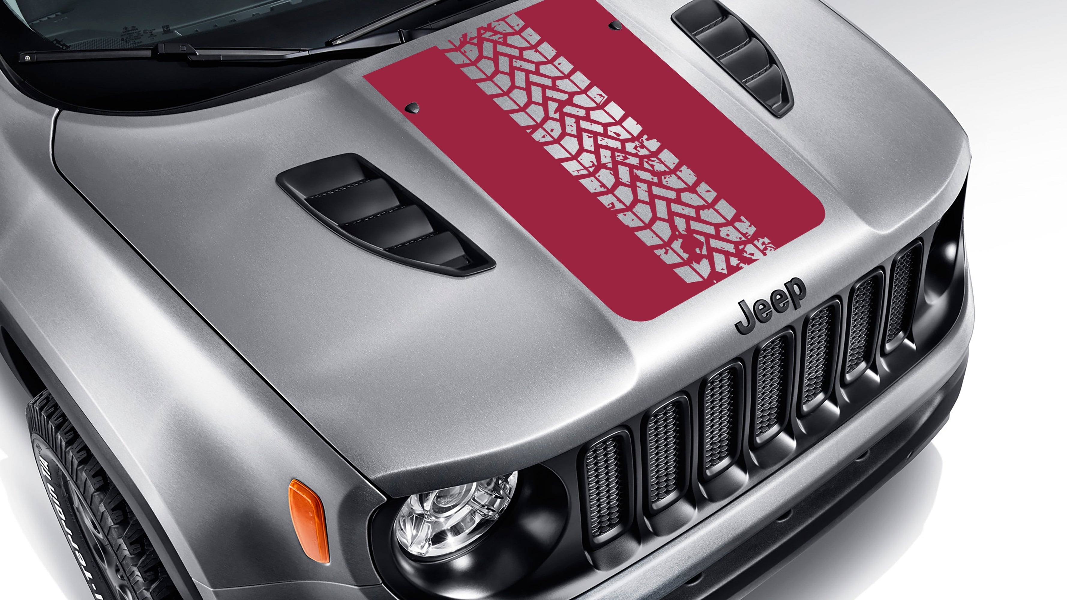 Dark red tire track blackout hood vinyl decal on silver Jeep Renegade hood with bold tread pattern