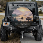Yellowstone National Park spare tire cover on a Jeep Wrangler, showing a bison beside a steaming geyser basin