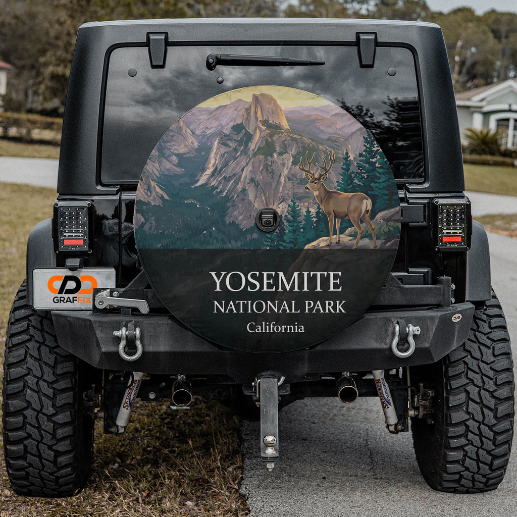 Yosemite National Park spare tire cover on a Jeep Wrangler, showing a mule deer on an outcrop below Half Dome