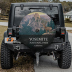 Yosemite National Park spare tire cover on a Jeep Wrangler, showing a mule deer on an outcrop below Half Dome
