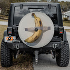 Duct-Taped Banana spare tire cover with banana taped to wall shown on black Jeep CDD GRAFFIX