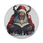Round tire cover art depicting Krampus in red robe reading a book amid snowy pine forest scenery