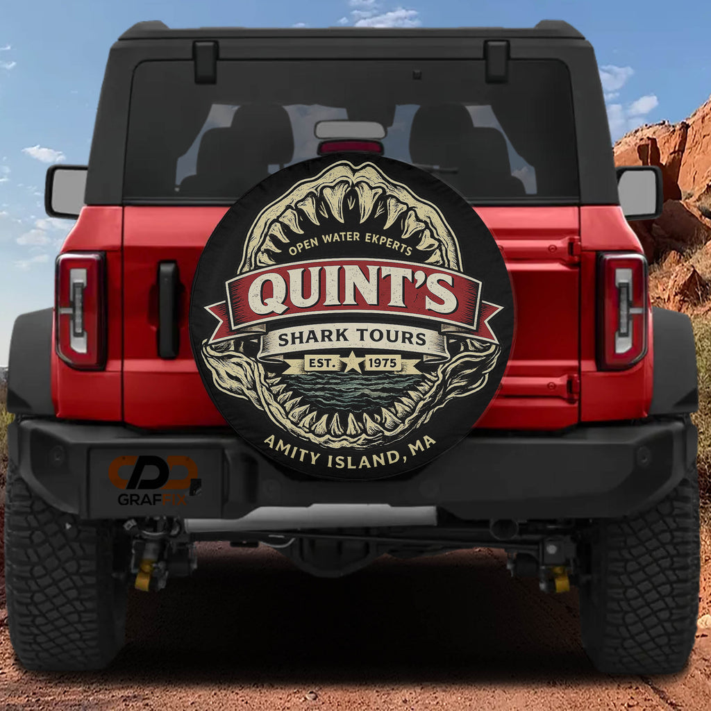 a red Jeep Wrangler with a shark-themed spare tire cover on the rear of the vehicle.