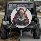 Dark holiday Krampus themed spare tire cover installed on the rear of a Jeep Wrangler vehicle