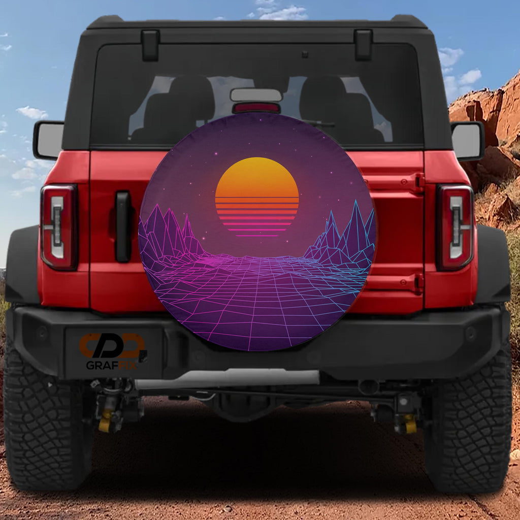 a red Jeep Wrangler with a large, colorful tire cover depicting a sunset landscape with mountains and a gradient of orange and purple hues.