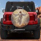 A red Jeep Wrangler with a large, circular decal of Jesus Christ in the sky on the rear window.