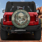 a red Jeep Wrangler with a large circular decal on the rear window that says "FOREST MOON EXPLORATIONS" and "GALACTIC FORESTRY SERVICE. EST. 1974".