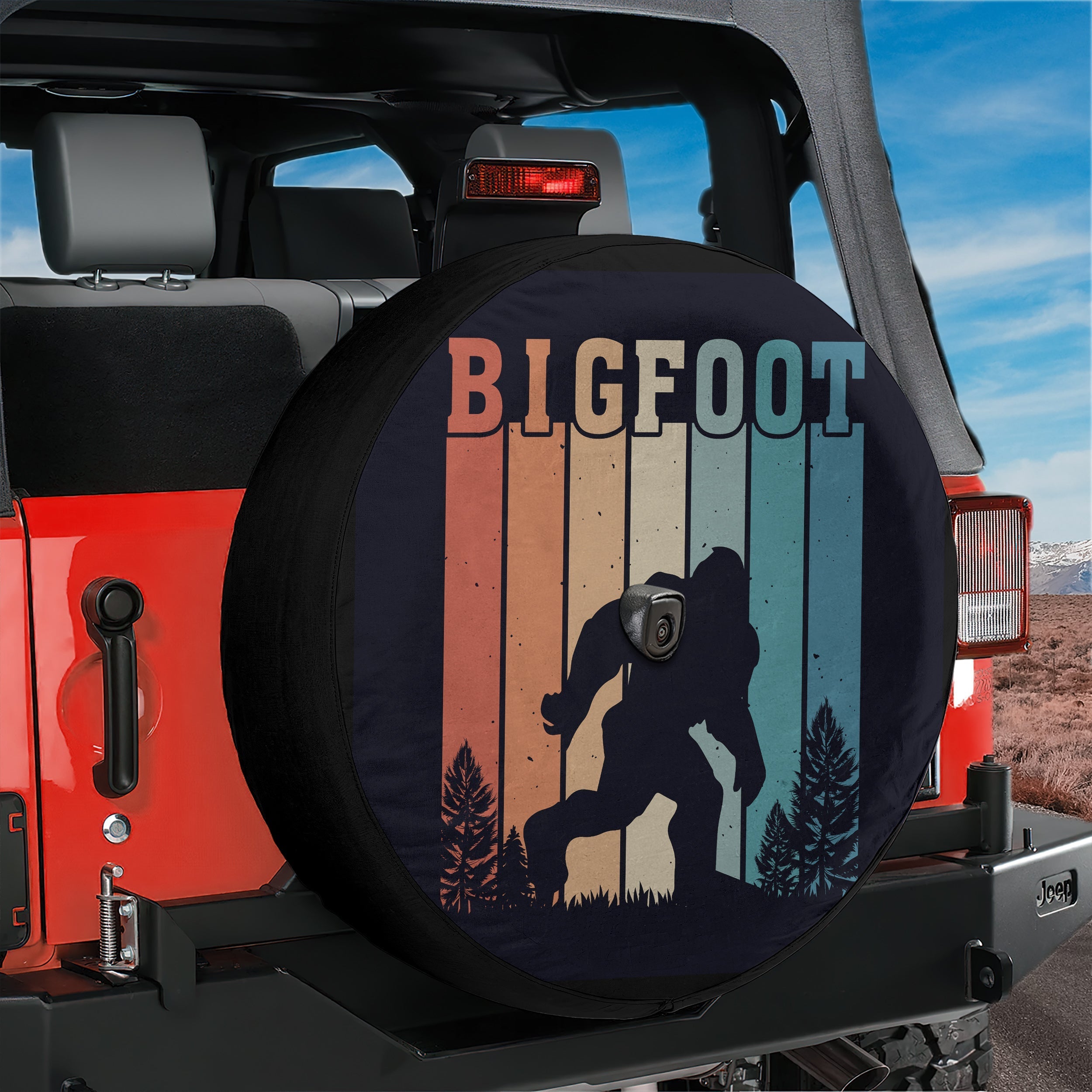 Sasquatch Stripes spare tire cover lifestyle view with classic retro Bigfoot rainbow silhouette graphic