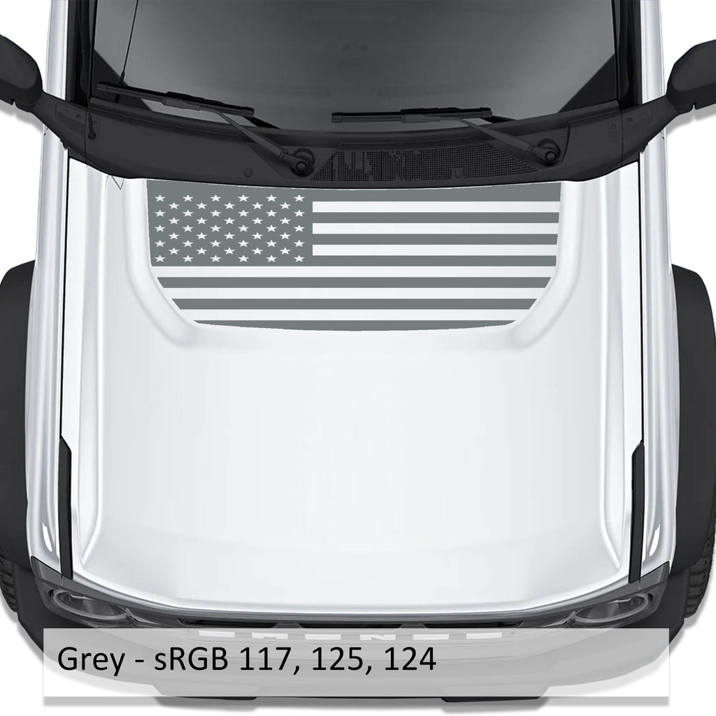 Grey American flag blackout hood vinyl decal shown installed on white Ford Bronco 2021 plus hood
