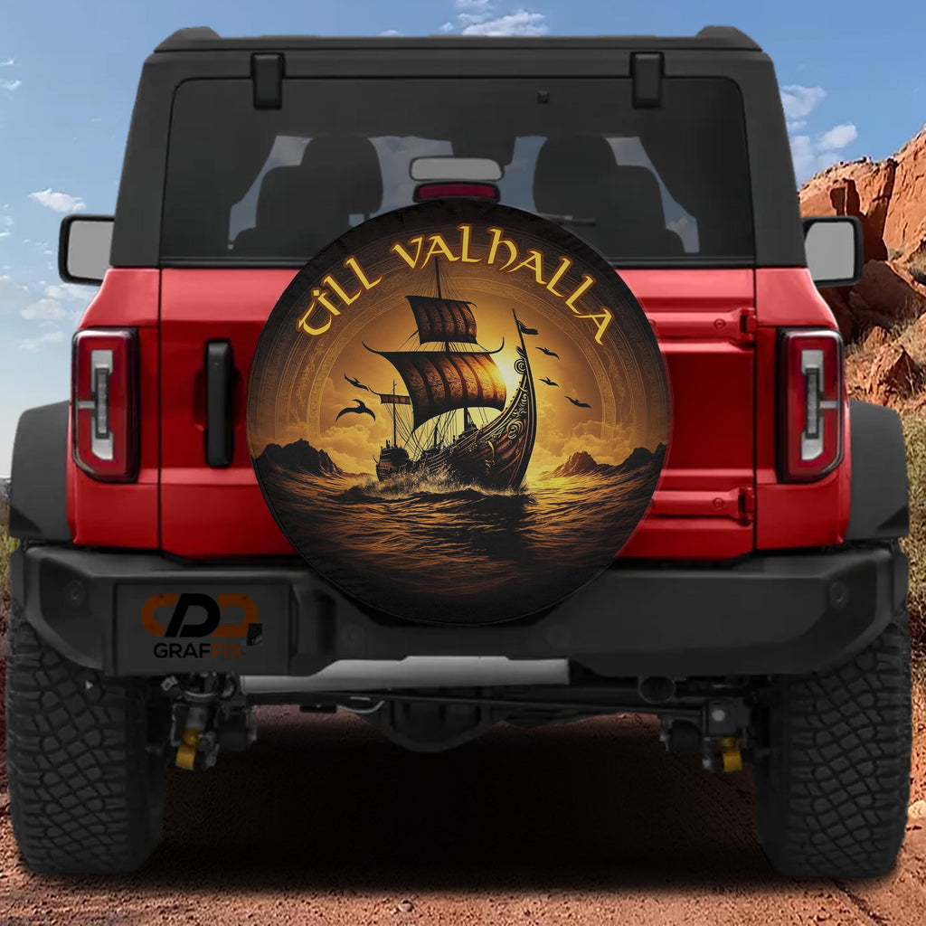 a red Jeep Wrangler with a large, decorative wheel cover depicting a Viking ship sailing on a lake.