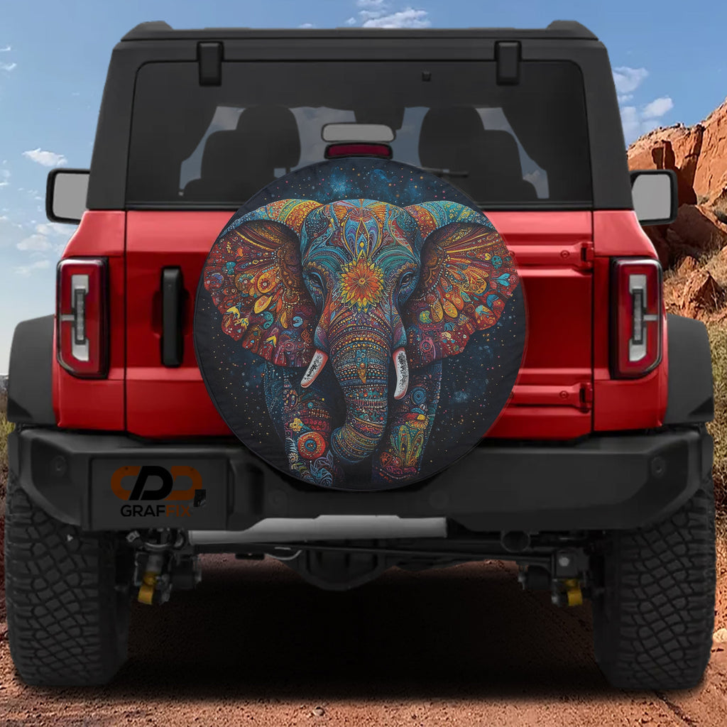 Colorful Mandala Elephant tribal painted tire cover on red Jeep Wrangler with red rock canyon view