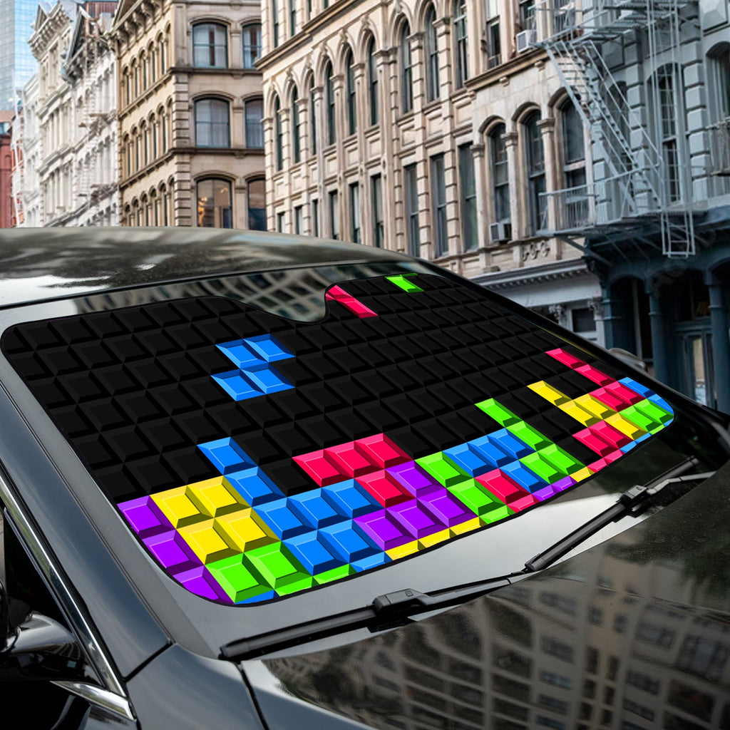 Pixel Block Puzzle accordion sunshade close-up installed on a dark sedan windshield exterior detail view