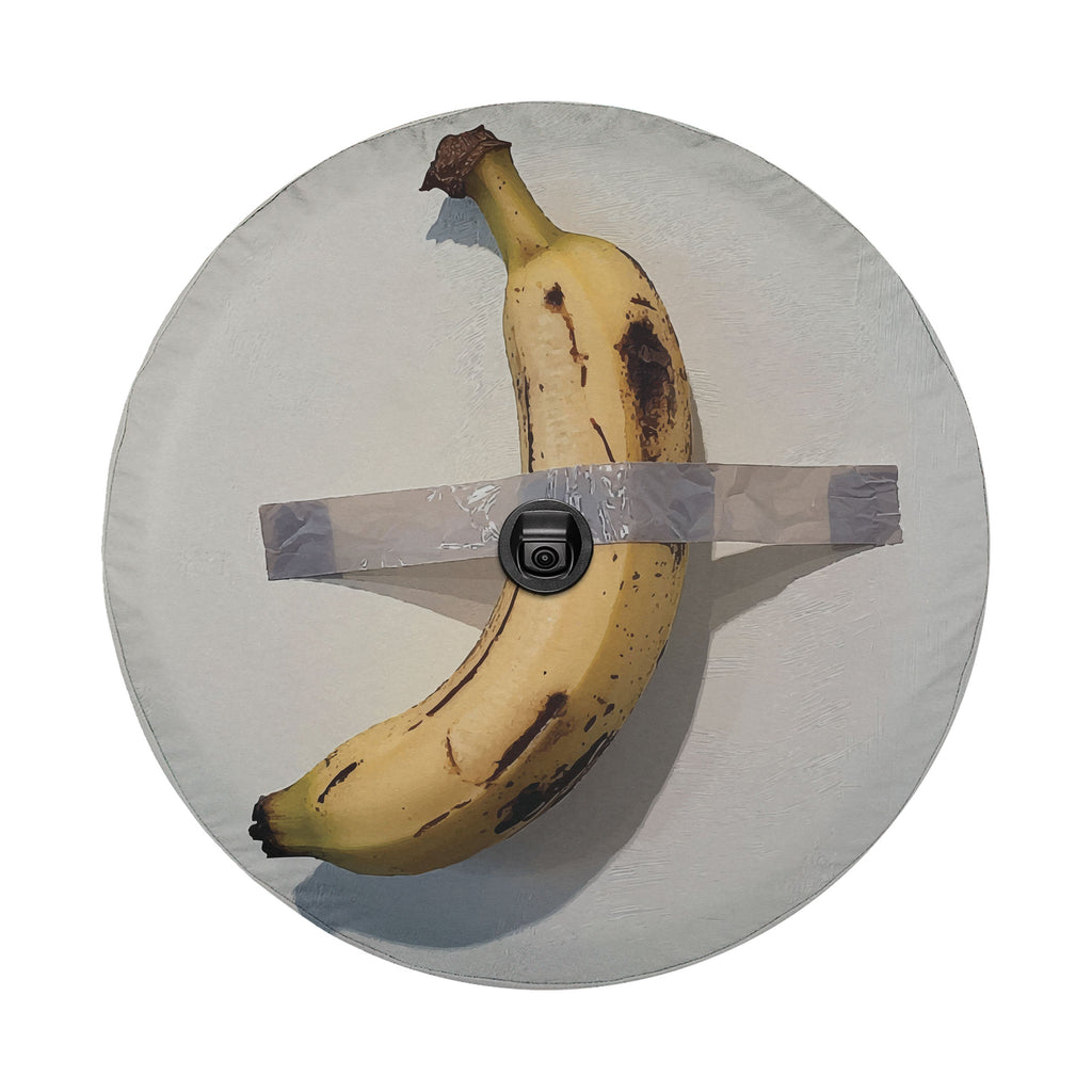 Duct-Taped Banana spare tire cover view of banana duct-taped to canvas with camera cutout hole