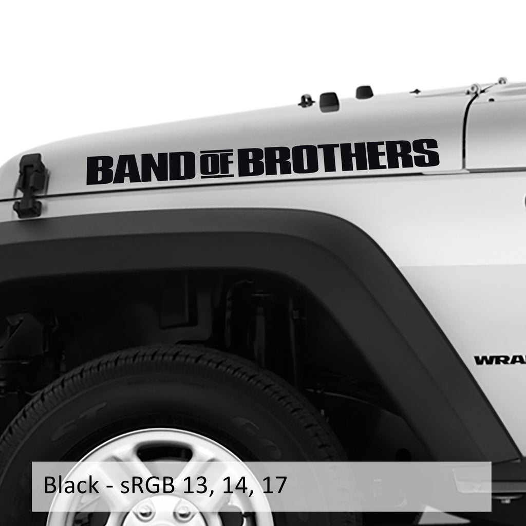Pair of BAND OF BROTHERS side-hood lettering decals shown in matte black on a white Jeep Wrangler fender panel
