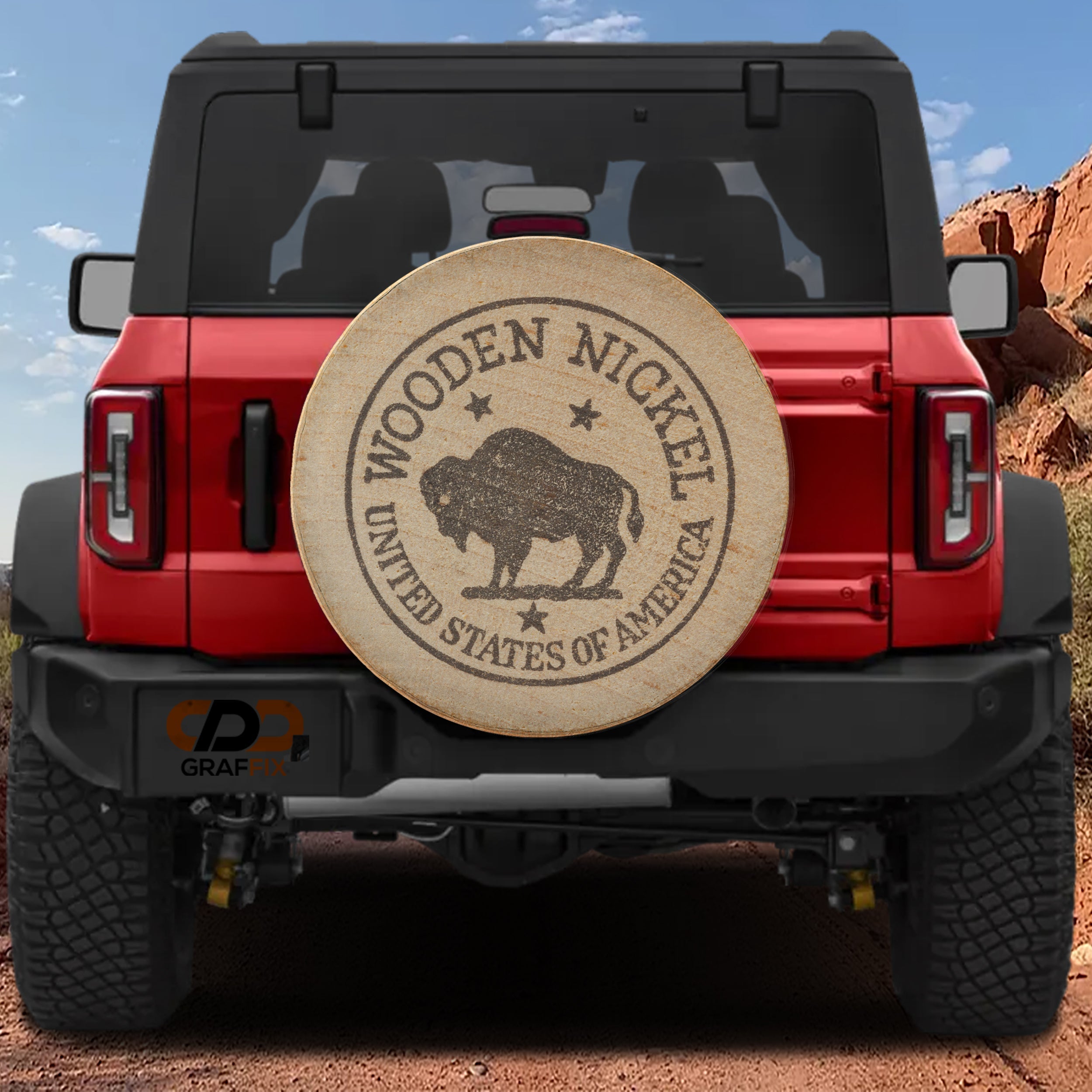 American buffalo wooden nickel spare tire cover on black Jeep Wrangler with wood grain coin