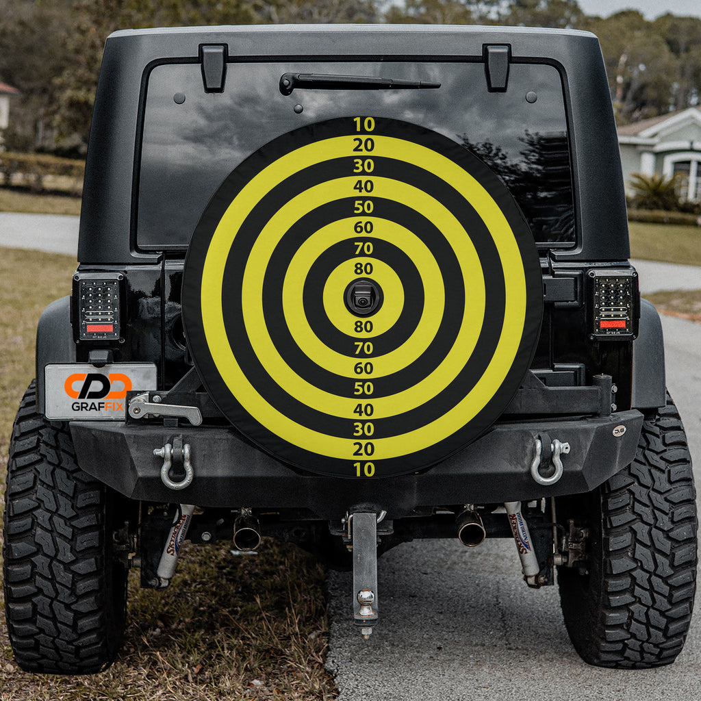 Magnetic Dart Board tire cover mounted on black Jeep Wrangler rear with colorful segments visible