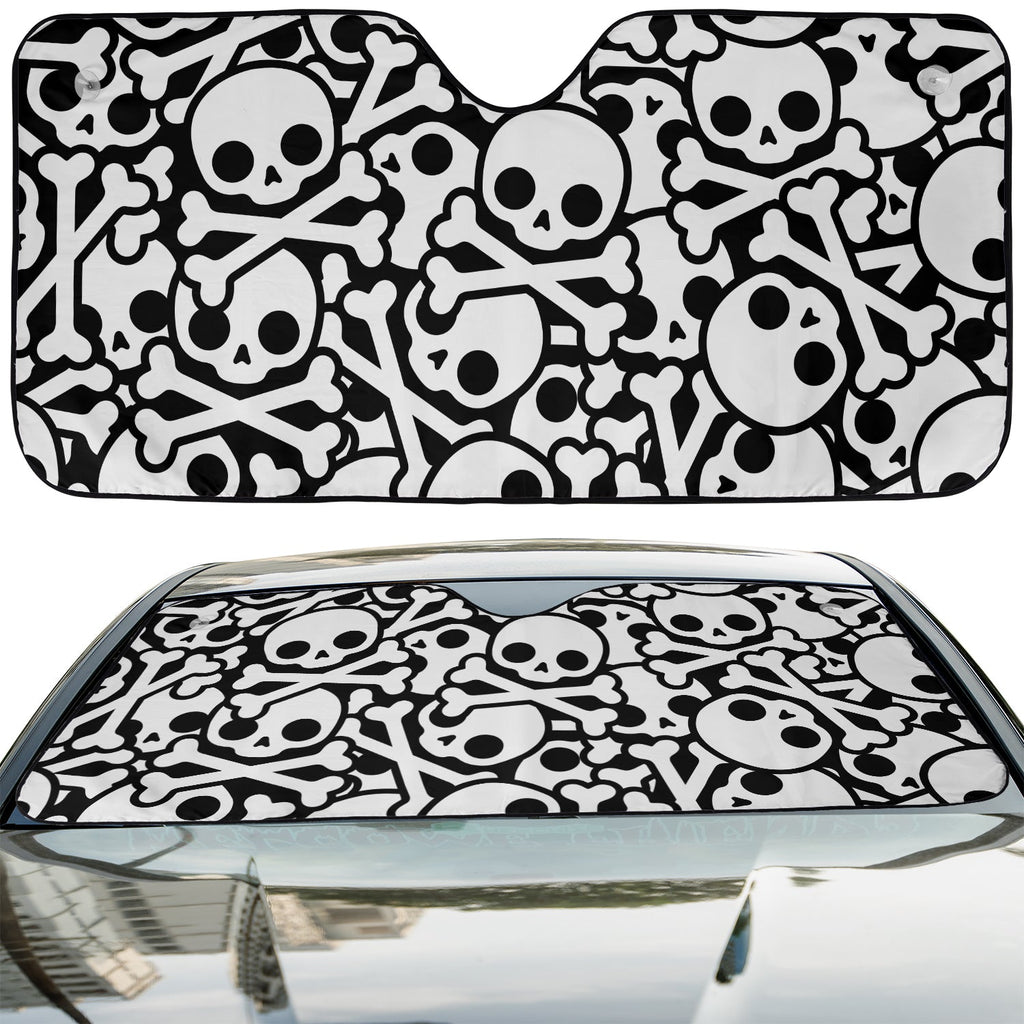 Skull and Crossbones accordion sunshade installed in a sedan windshield on a sunny urban street view