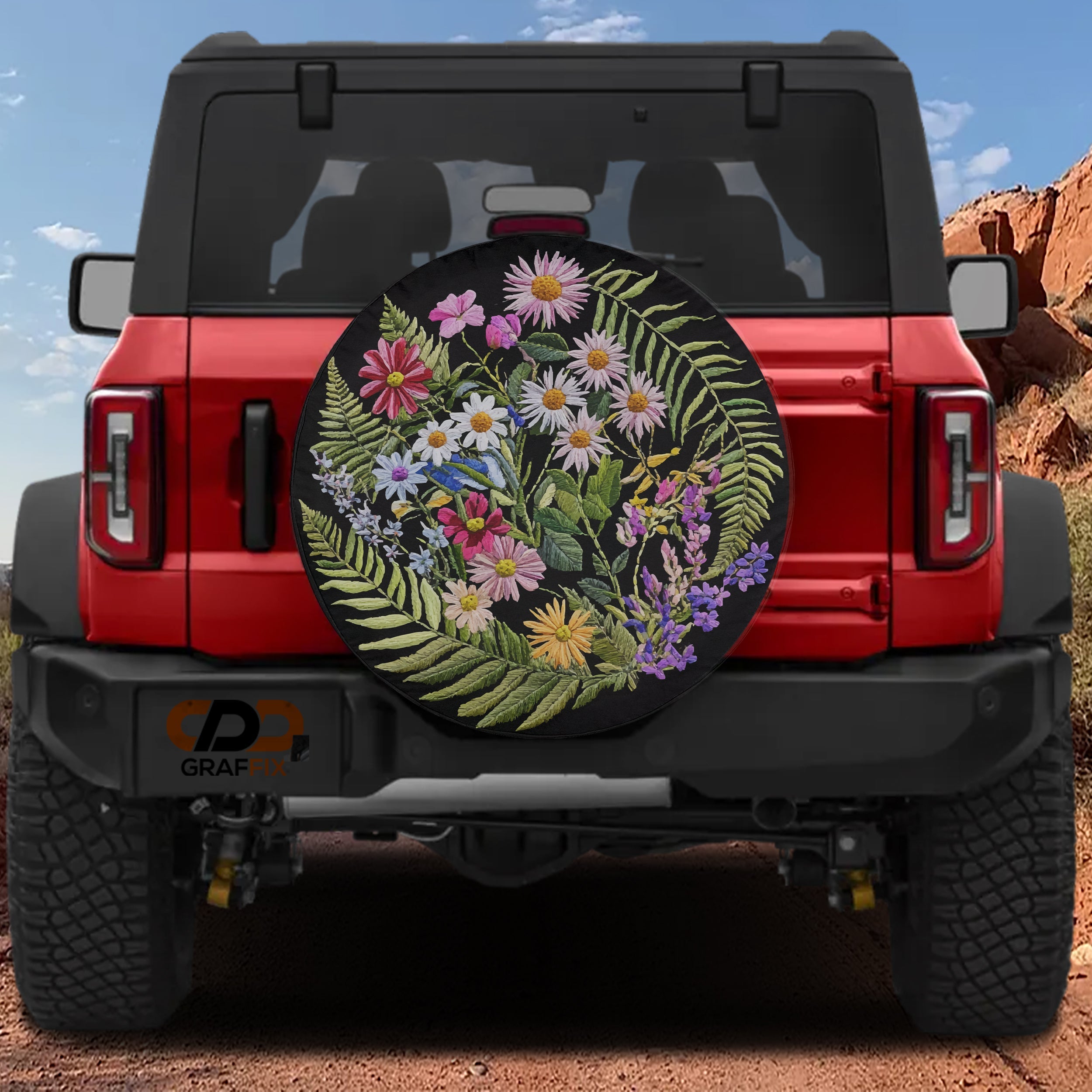 Faux embroidery wildflowers floral spare tire cover mounted on red Ford Bronco rear