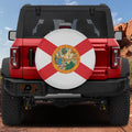 Florida state flag spare tire cover mounted on red Ford Bronco rear with red rock canyon backdrop