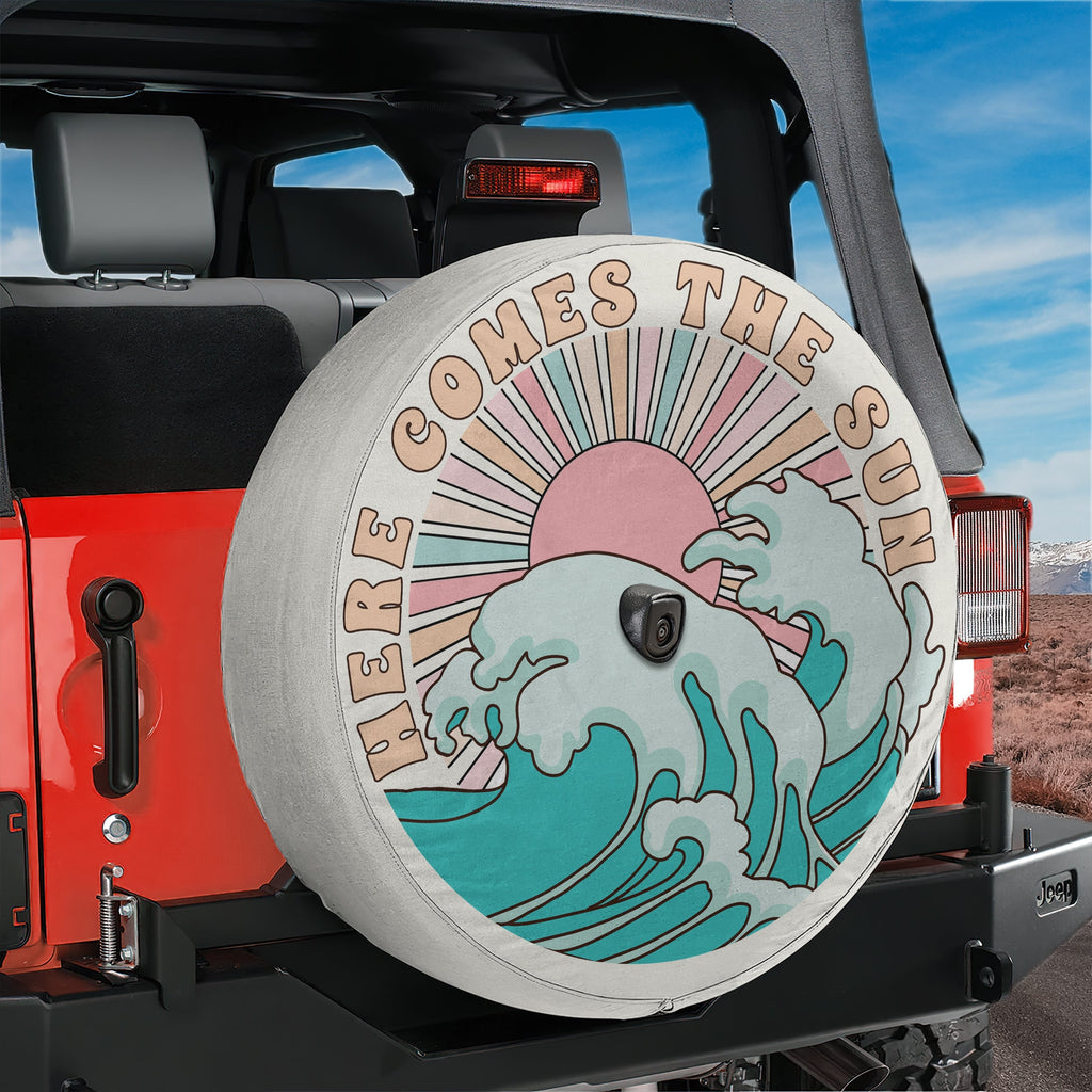 Here Comes the Sun spare tire cover on black Jeep Wrangler showing pastel sun wave design
