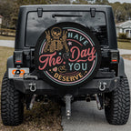 Have the Day You Deserve spare tire cover alternate angle showing rocker skeleton circle badge art