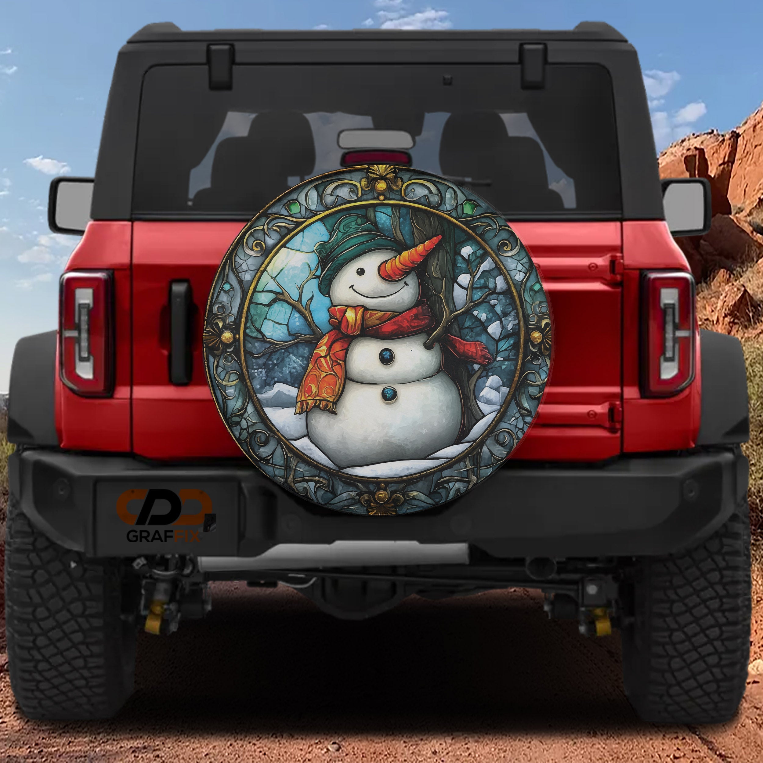 Red Ford Bronco rear with stained glass snowman holiday spare tire cover featuring orange scarf