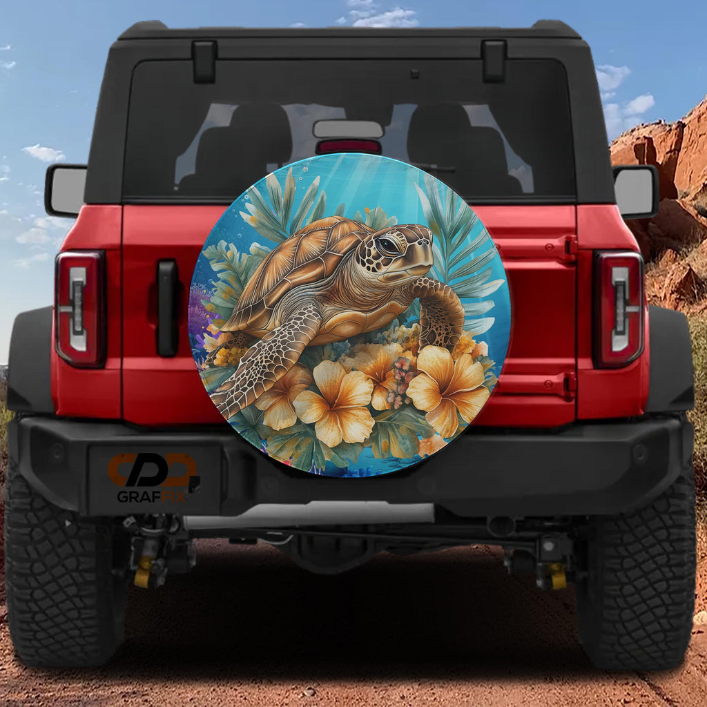 A red Jeep Wrangler with a large, colorful wheel cover depicting a sea turtle and tropical flowers.