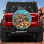 A red Jeep Wrangler with a large, colorful wheel cover depicting a sea turtle and tropical flowers.