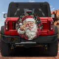 Red Ford Bronco rear with Goofy cartoon Santa Claus peace sign leopard print snowflake tire cover