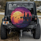 a Jeep Wrangler with a large, colorful wheel cover featuring a spooky castle scene at night.