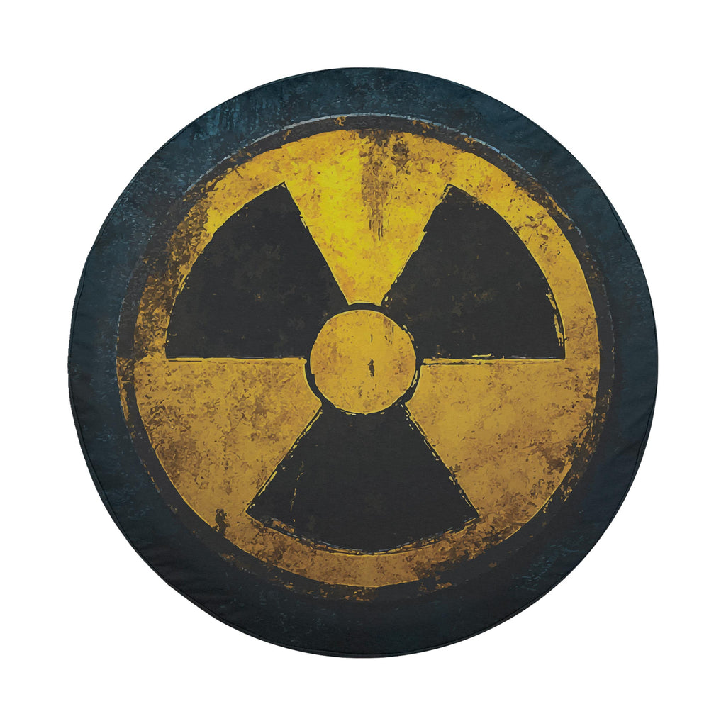 Fallout shelter radiation symbol spare tire cover on a black Jeep Wrangler with GRAFFIX rear bumper sticker
