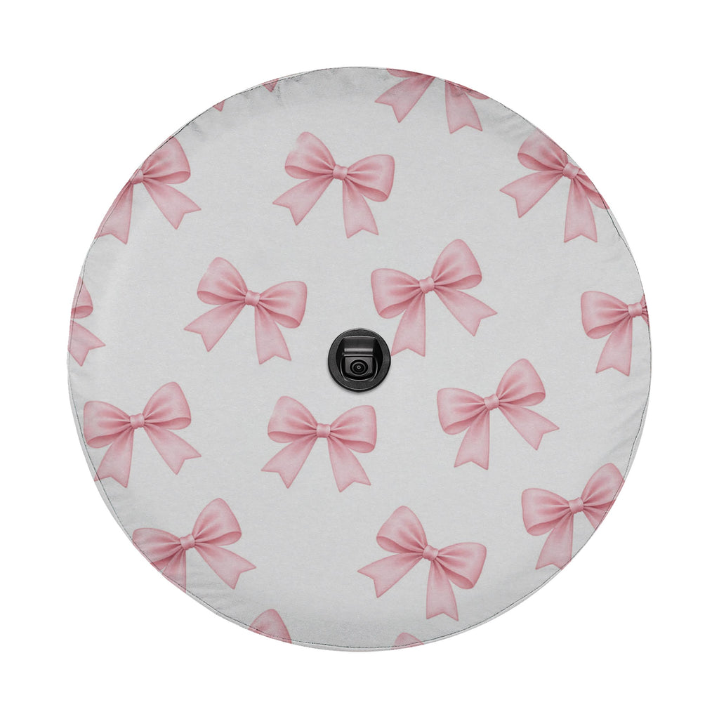 a circular object with a repeating pattern of pink bows on a white background.
