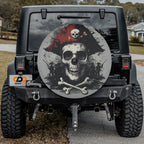 Dread Pirate skull and crossbones tire cover on black Jeep Wrangler rear in residential street view