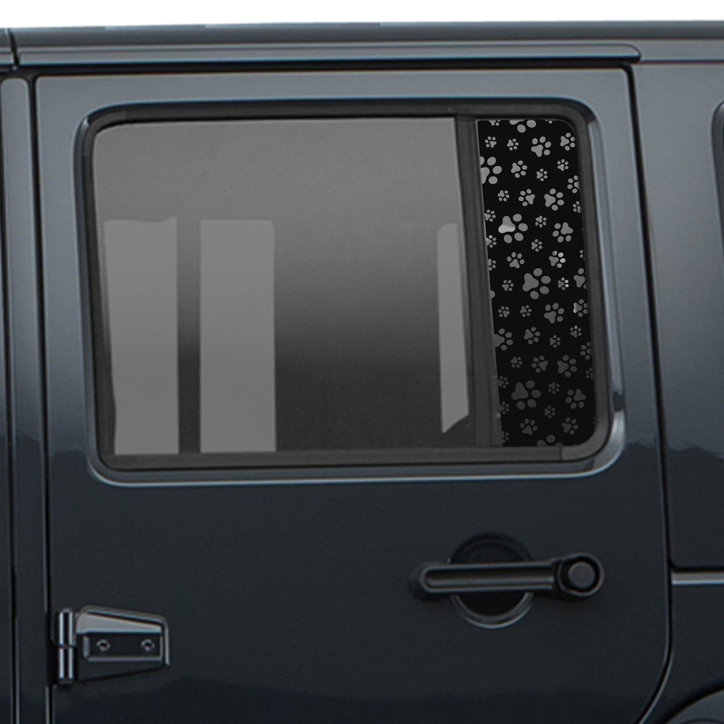Black dog paw print pattern side rear window decal shown on dark Jeep Wrangler JKU 4-door body
