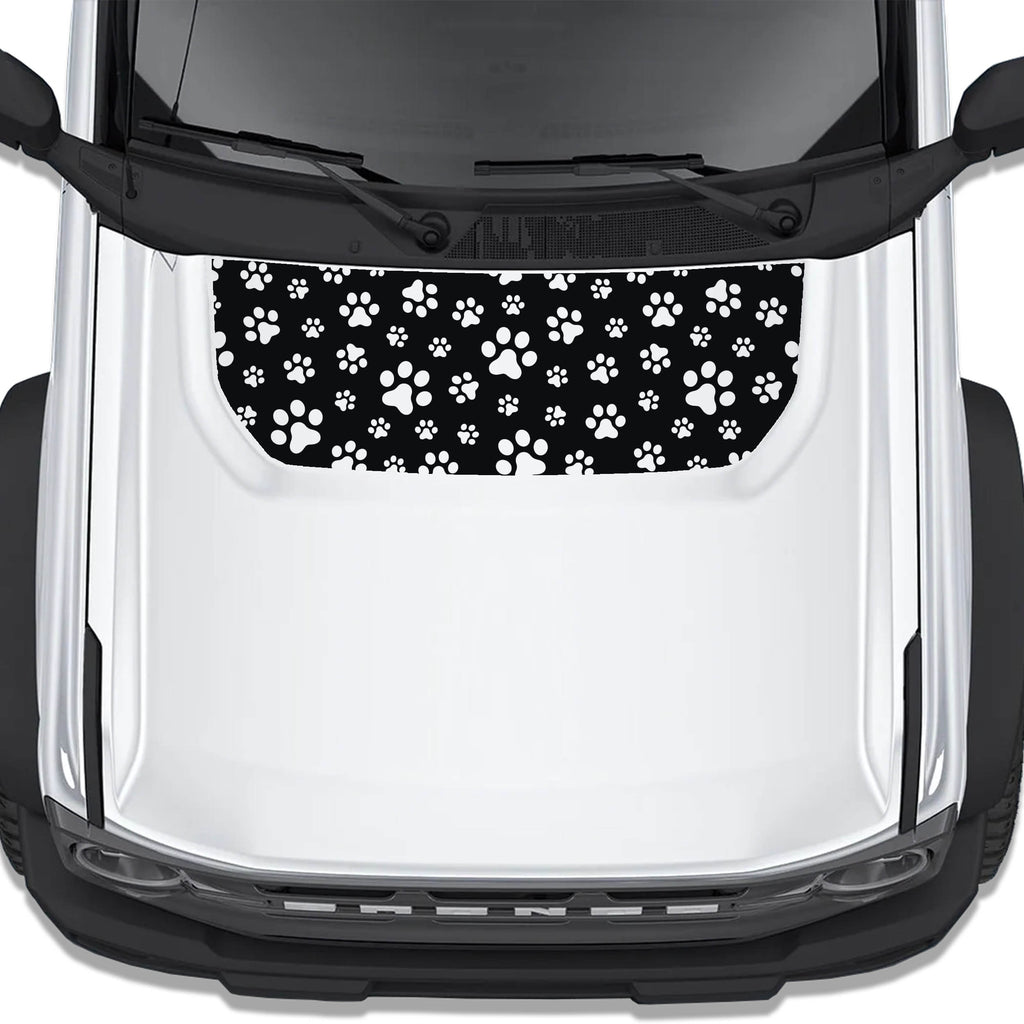 White dog paw print blackout hood vinyl decal installed on Ford Bronco 2021 plus, top view