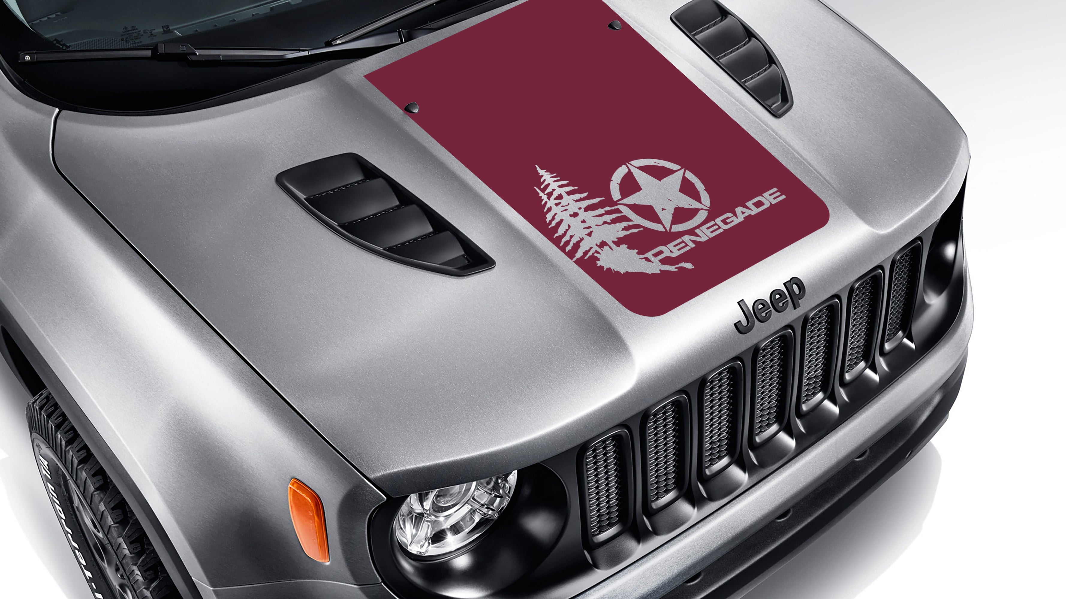 Burgundy distressed star with pine trees blackout hood decal on silver Jeep Renegade hood