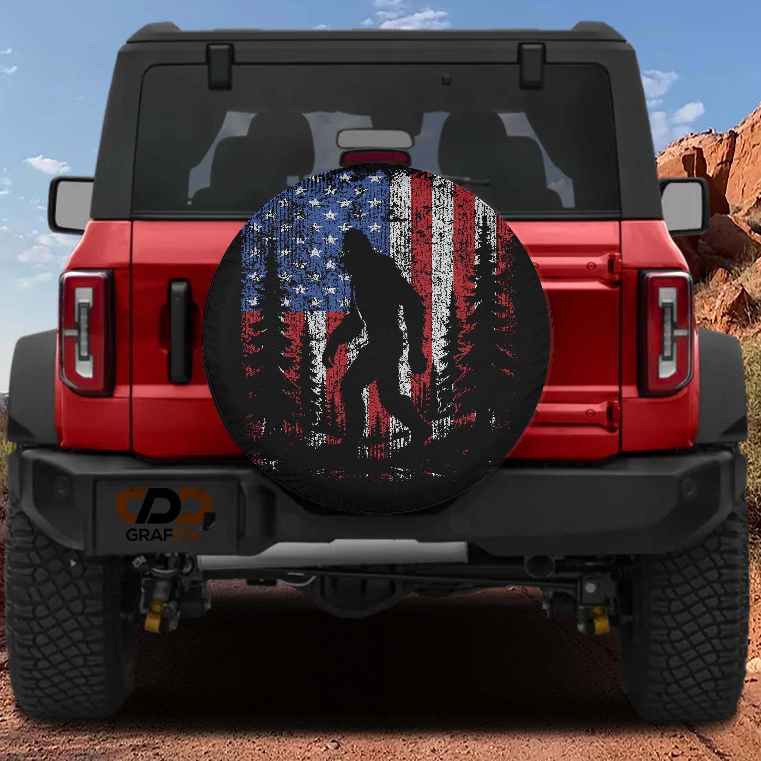Bigfoot Across America spare tire cover with sasquatch and American landmarks patriotic scene