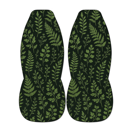 two identical car seat covers with a repeating pattern of green leaves and branches.