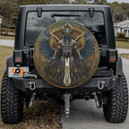 Close-up Egyptian pharaoh winged deity spare tire cover disc showing detailed hieroglyph art and camera hole